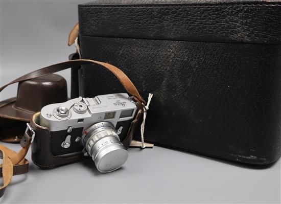 A Leica Wetzlar M2 - 1037 356 DBP camera with Summicron f=5cm 1:2 lens No. 1592327 and case of accessories